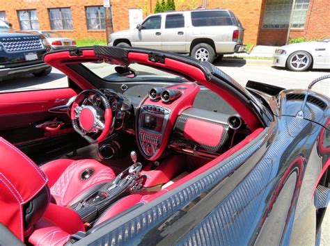 Interior of the Pagani Huayra Roadster in fully exposed Black carbon fiber w/ Red accents Photo ...