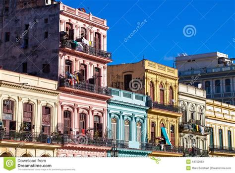 Many Different Colored Buildings With Balconies On Top