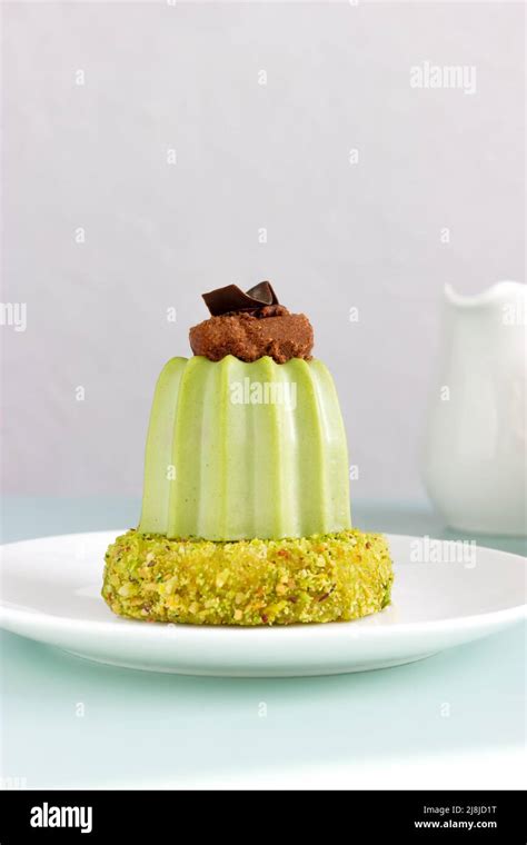 Dessert Pistachio Mousse With Cherry Brownie On Pistachio Dacquoise On