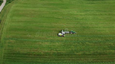 Loading Hay With A Combine Into A Tractor Trailer Stock Video Video