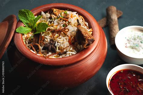 Matka Dum Biryani With Yoghurt And Curry Stock Photo Adobe Stock