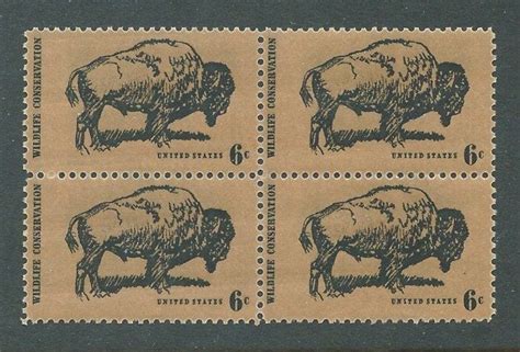 Four Stamps With Buffalos On Them