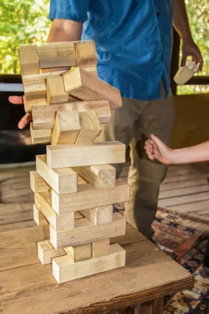 Premium Photo Midsection Of Man Adjusting Wooden Blocks