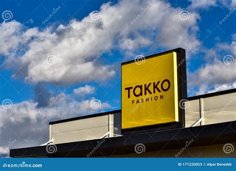 Takko Fashion Street Sign White Clouds On Blue Sky In The Background