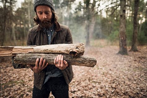 Man Gathering Fire Wood Del Colaborador De Stocksy Itla Stocksy