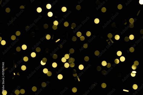 gold confetti on black background created with generative AI Stock ...