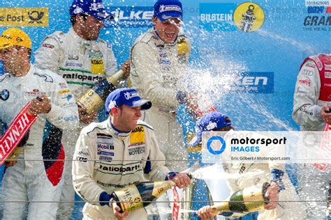 Podium Timo Bernhard And Romain Dumas Celebrate 24 Hours Of