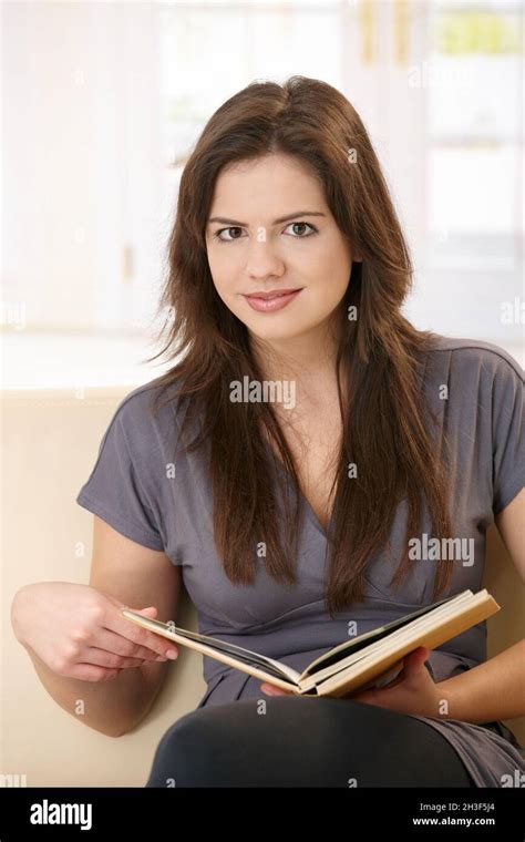 Girl holding book Stock Photo - Alamy