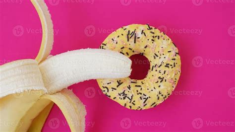 Sweet Donut And Banana On Pink Color Background Erotic Concept 3257969