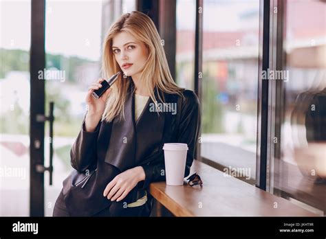 Beautiful Blonde In A Cafe Stock Photo Alamy