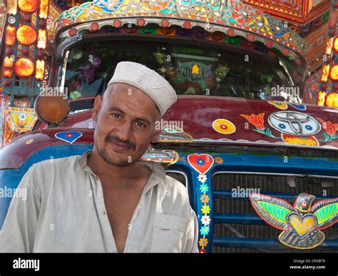 pakistani truck driver proud   colorful vehicle gilgit north