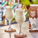 Island Oasis Pina Colada Frozen Beverage Mix 32 fl. oz. - 12/Case