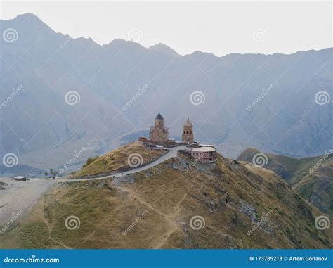 Gergeti Trinity Church on the Sunrise in Georgia Stock Photo - Image of ...