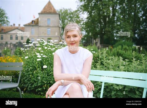 Outdoor Portrait Of Beautiful Mature Year Old Woman Admiring Old Castle European