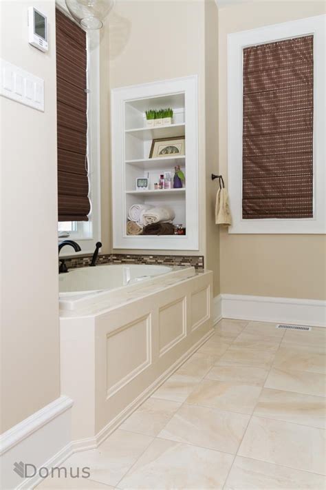 Light Tile Flooring And A Backsplash Around The Bath Bathroom Remodel