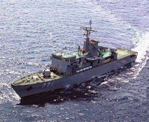 an aerial view of a navy ship in the middle of the ocean with water ...