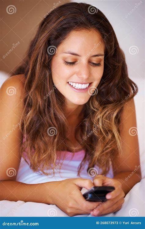 Beautiful Woman Text Messaging Beautiful Woman Lying In Bed And Text