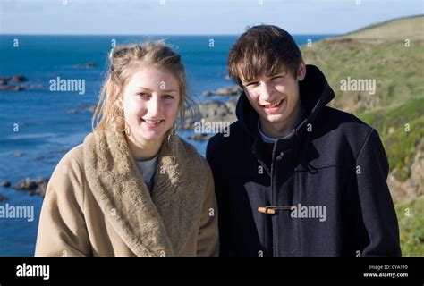 Nineteen Year Old Boy Girl Twins Portrait Outdoors By The Sea In Winter