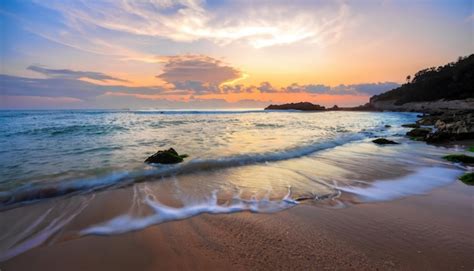 Premium Photo | Beautiful beach on sunrise below the waves lapping