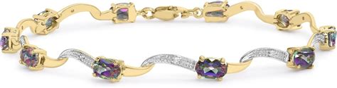 Carissima Gold Women S Ct Yellow Gold Diamond And Oval Mystic Topaz