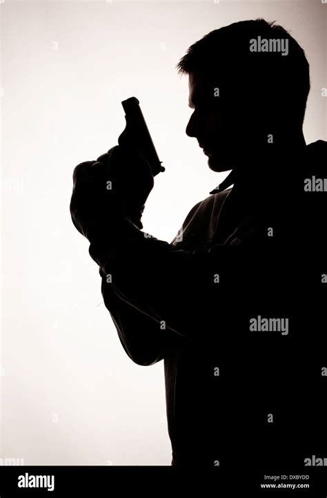 Man With Gun Silhouette Hi Res Stock Photography And Images Alamy