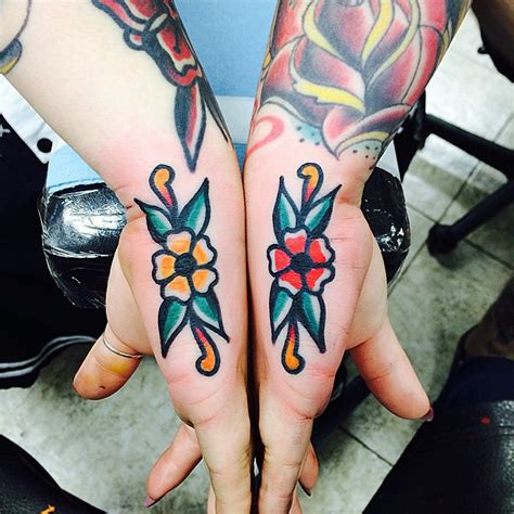 Matching Traditional Flower Tattoos On Hands Tattoogrid Net