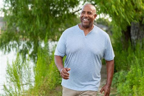 Portrait Of A Mature Man Walking And Getting Exercise Stock Photo Image Of Morning Older