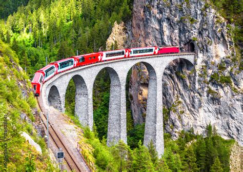 Bernina Express train on Landwasser Viaduct, Switzerland. Aerial scenic ...