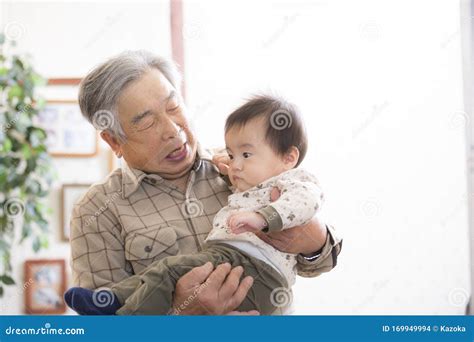 Old Man Grandpa Holding His Painful Lower Back Colored In Red Stock Image