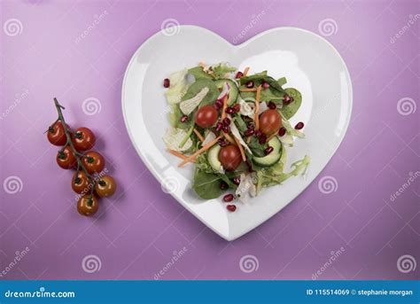 Traditional Salad on a Heart Shaped Plate with Tomatoes on the Vine ...