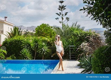 Sexy Hot And Fashionable Blonde Model Girl In White Stylish Swimsuit