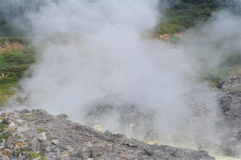 Sulphurous Mountain Valley With Hot Spring Stream And Steam At Tamagawa Onsen Hot Spring In