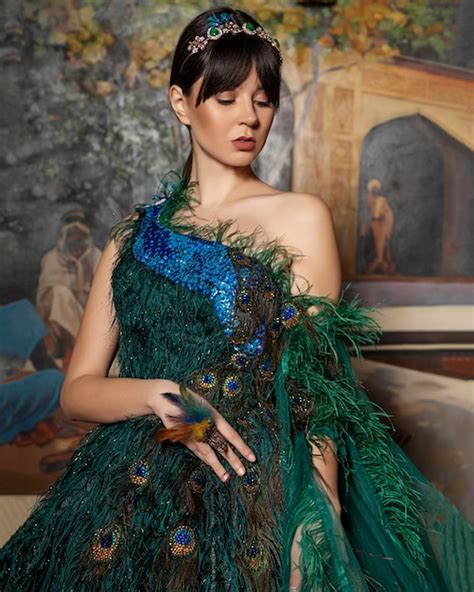 Premium Photo A Woman In A Green Dress With A Peacock Feather On Her Head