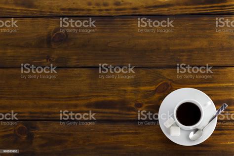 Black Coffee With 2 Sugars White Cup On A Brown Wooden Table Top View