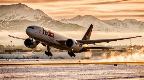 Download Fedex Hd Plane Flying Wallpaper | Wallpapers.com