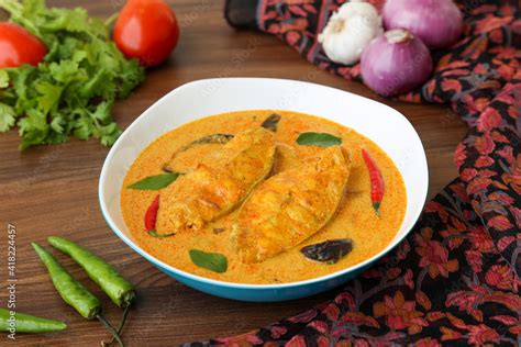 Kerala fish curry coconut milk gravy , cooking spicy Goan fish curry ...