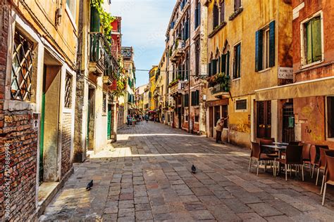 Narrow street in the old town in Venice Italy Stock Photo | Adobe Stock