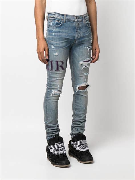 Amiri Ripped Knee Logo Print Skinny Jeans Luxdiscount