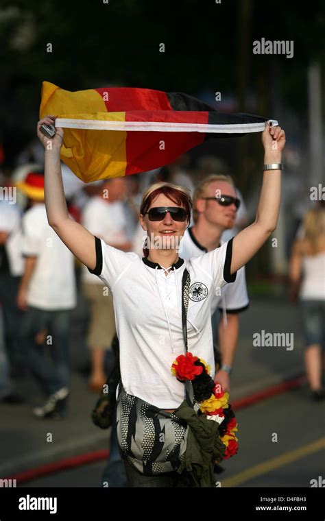 A Female German Supporter Waves A Flag Downtown Basel Prior To The Uefa