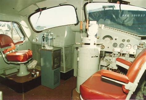 Old Train Interior with Red Chairs