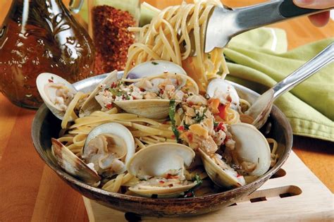 Linguini Clams Being Pulled Apart With Utensils Prepared Food Photos