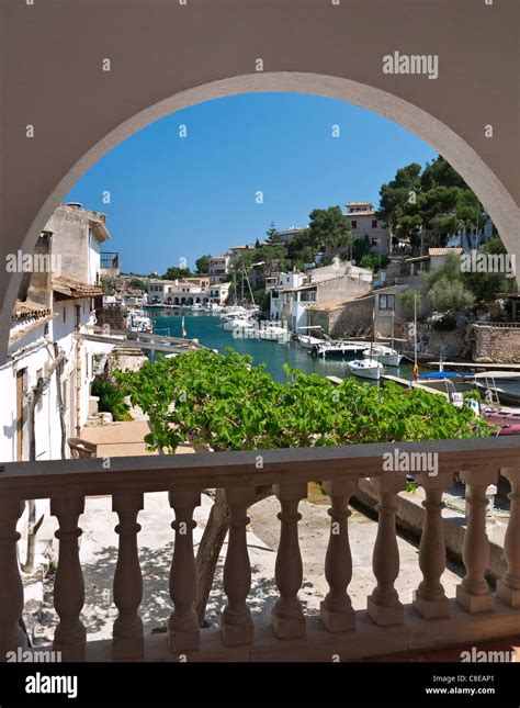 Cala Figuera Harbour View Framed By Vacation Villa Arch With Fishing