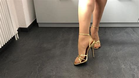 Golden Stiletto High Heels With Red Nails And Stockings Amateur