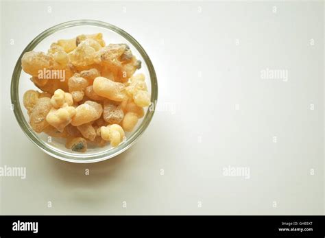 Frankincense Drops In A Glass Bowl On White Background With Copy Space