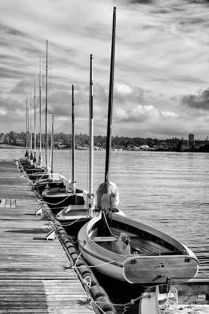 Premium Photo Boats Moored At Harbor Against Sky