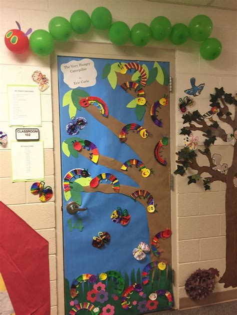 A Door Decorated With Colorful Paper Flowers And Trees On The Front