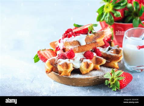 Belgian Waffles With Creem And Raspberries And Strawberries Stock Photo