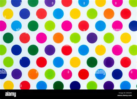 Colourful polka dot pattern on white background Stock Photo - Alamy