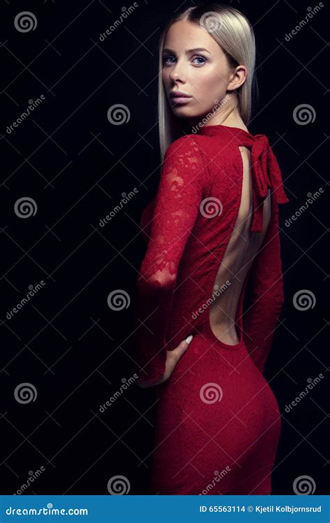 Dark Portrait Of A Blonde Woman In Red Dress Stock Photo Image Of