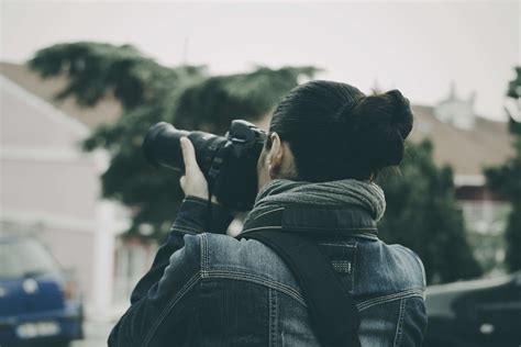 camera female paparazzi person photographer